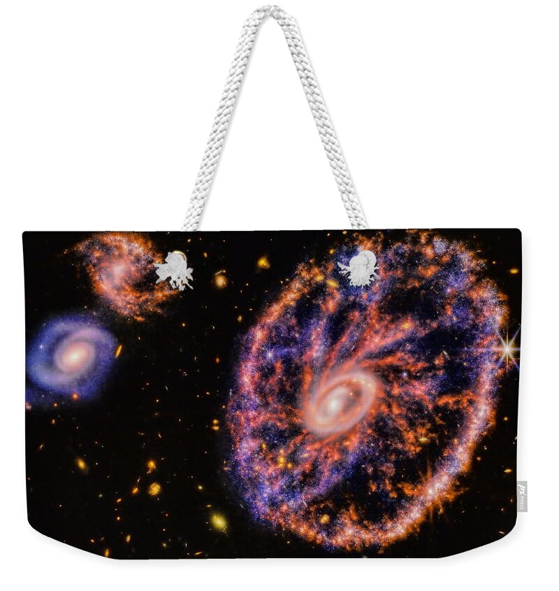 Deep Space Weekender Tote Bag featuring the photograph Cartwheel Galaxy by Dale Kauzlaric