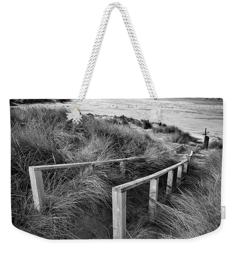 Castlerock Weekender Tote Bag featuring the photograph Castlerock Beach by Nigel R Bell