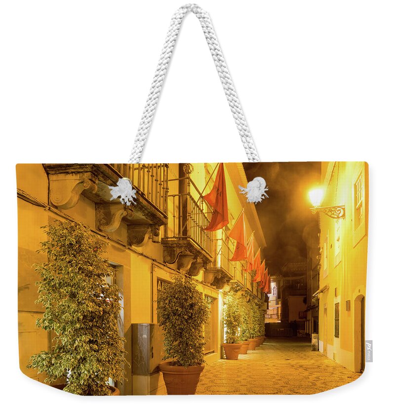 Charming Faro Weekender Tote Bag featuring the photograph Charming Faro Algarve Portugal - Fab Small Street with Flags and Sea Mist Lens Flares by Georgia Mizuleva