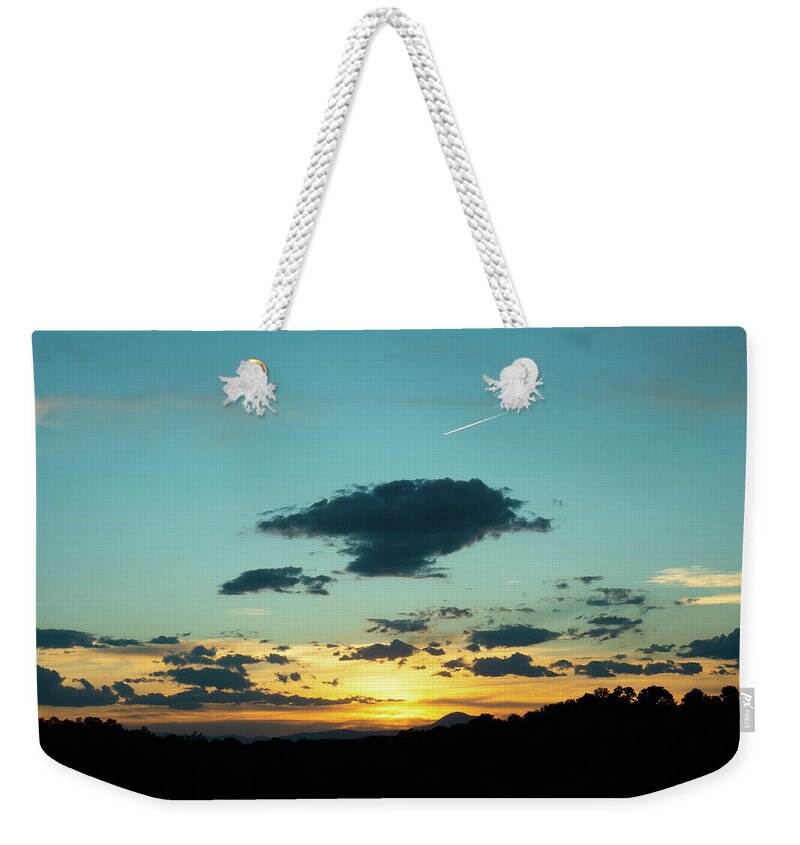 Sunset Weekender Tote Bag featuring the photograph Chasing the Sunset by Ron Long Ltd Photography