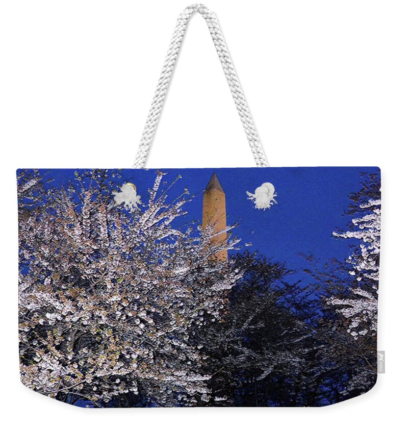 Cherry Blossom Weekender Tote Bag featuring the photograph Cherry blossoms overlooking Washington monument 1 by Harsh Malik