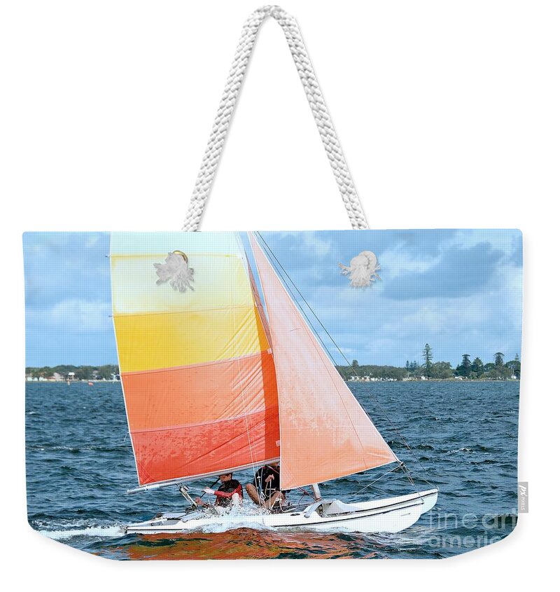 Sunnypicsoz.com Weekender Tote Bag featuring the photograph Children Sailing racing boats. by Geoff Childs