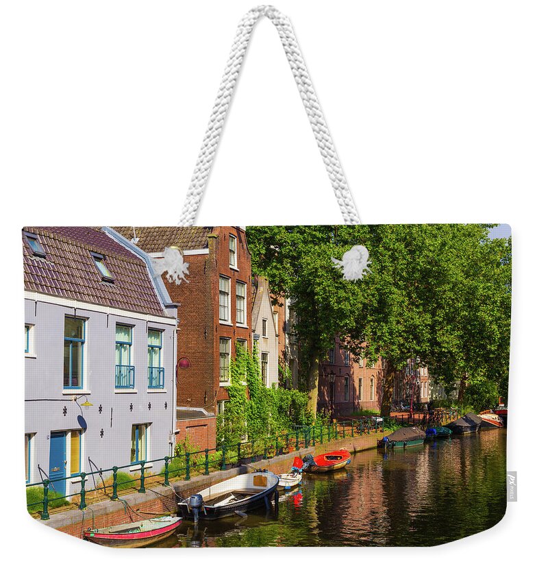 City Weekender Tote Bag featuring the photograph City canal in Amsterdam by Fabiano Di Paolo