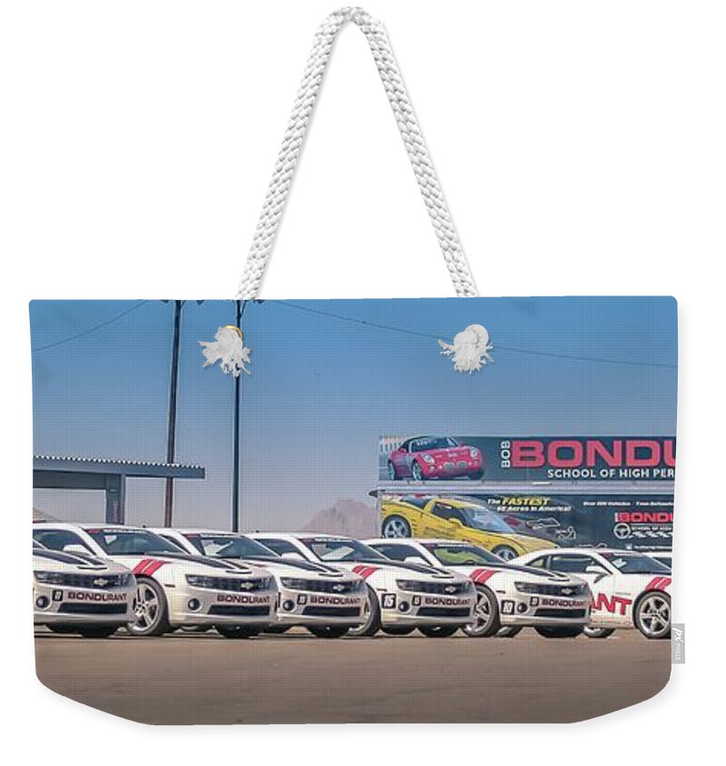 Chevy Weekender Tote Bag featuring the photograph Class of Camaro's by Darrell Foster