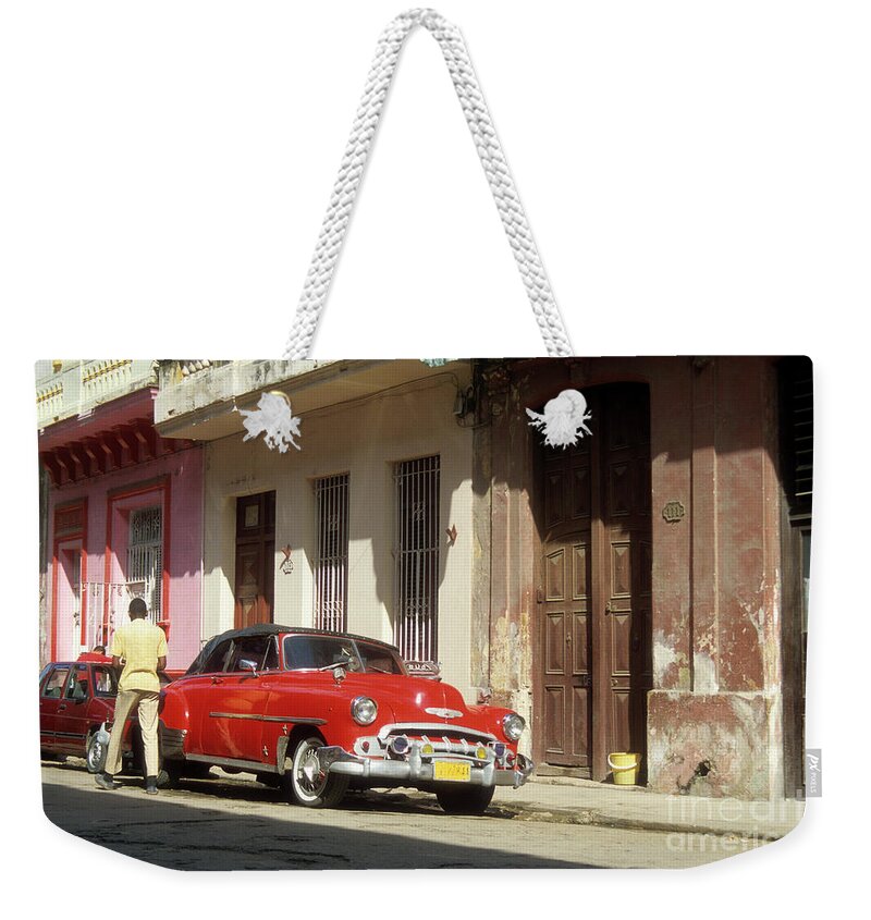 Havana Weekender Tote Bag featuring the photograph Classic Chevrolet in La Habana Vieja Cuba by James Brunker