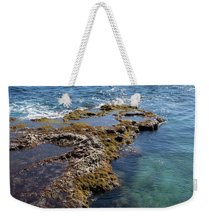 Mediterranean Coast Weekender Tote Bag featuring the photograph Clear water and the Penon de Ifach in Calpe by Adriana Mueller