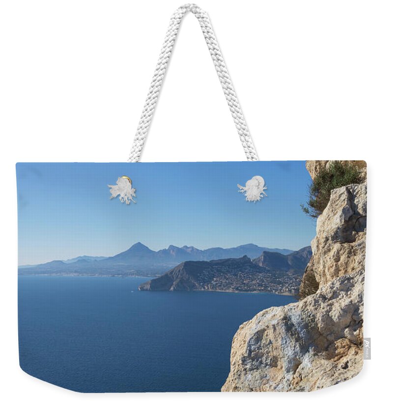 Mediterranean Coast Weekender Tote Bag featuring the photograph Cliffs, blue sky and the Mediterranean Sea by Adriana Mueller