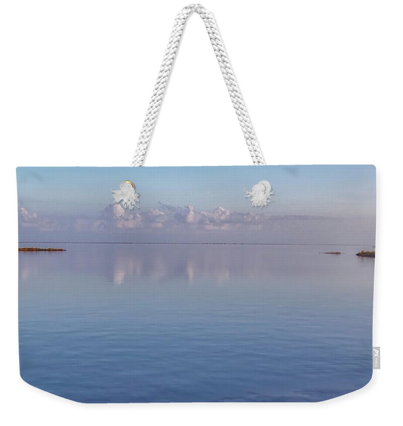 Cedar Island Weekender Tote Bag featuring the photograph Cloud Reflections on the Pamlico Sound by Bob Decker