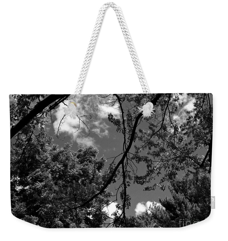 Nature Weekender Tote Bag featuring the photograph Clouds and Trees Black and White - Frank J Casella by Frank J Casella