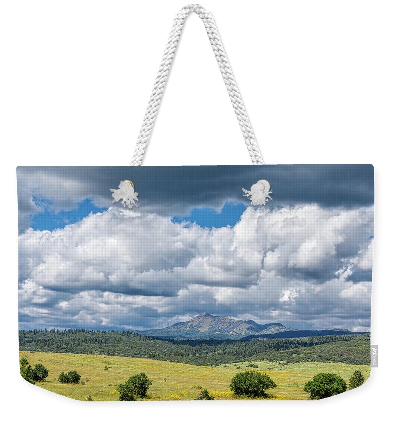 Chama Weekender Tote Bag featuring the photograph Clouds Build Over Landscape of Chama New Mexico by Debra Martz