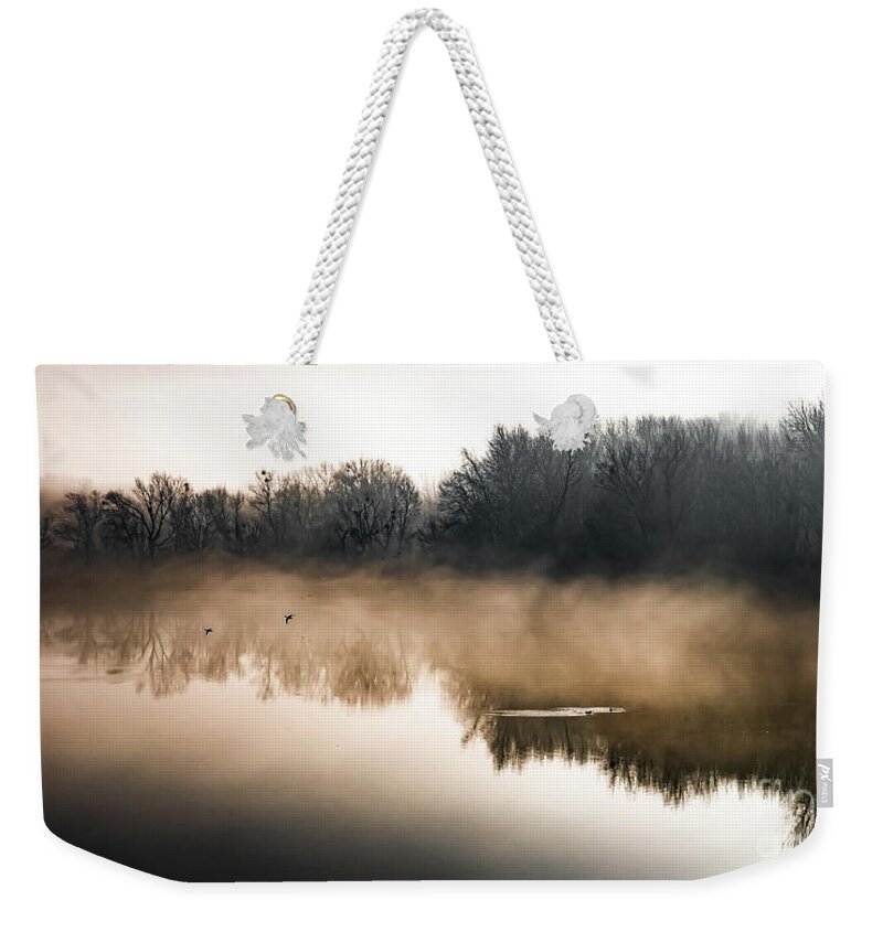 Atmosphere Weekender Tote Bag featuring the photograph Clouds Of Mist Over The Watershed Of National Park River Danube Wetlands In Austria by Andreas Berthold