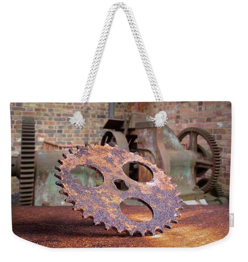 Cog Weekender Tote Bag featuring the photograph Rusty cog by Average Images