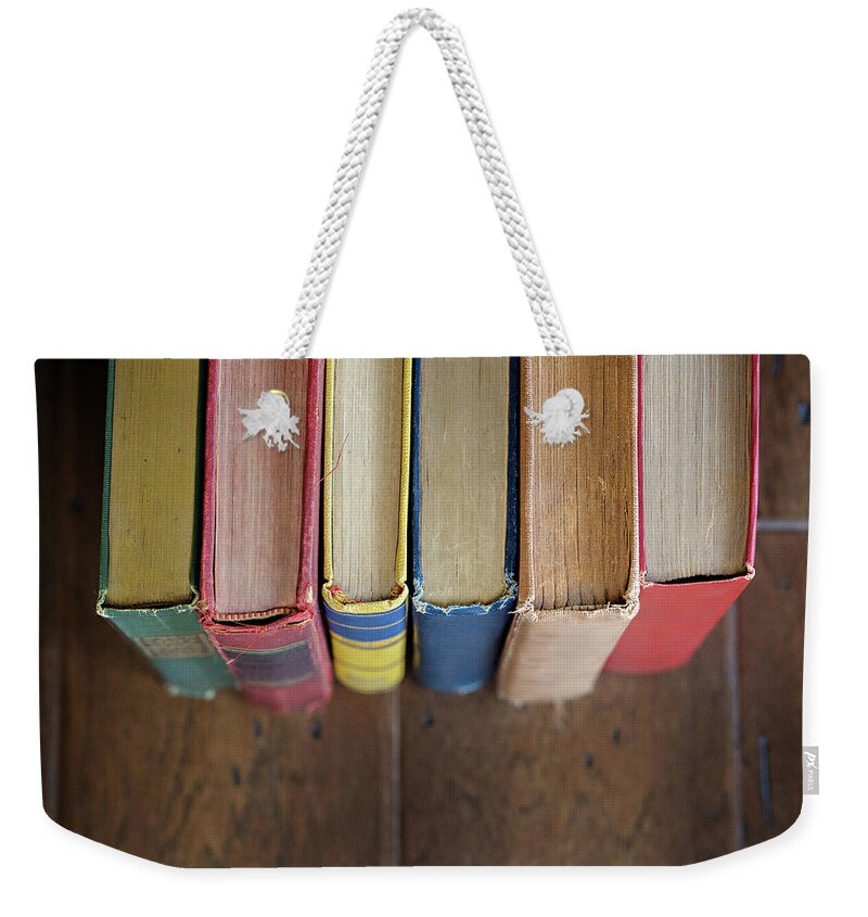 Colorful Weekender Tote Bag featuring the photograph Colorful Antique Books by Carolyn Ann Ryan