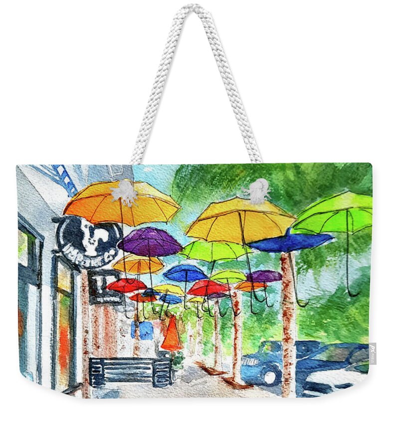 Dunedin Weekender Tote Bag featuring the painting Colorful Dunedin Umbrellas by Debbie Lewis