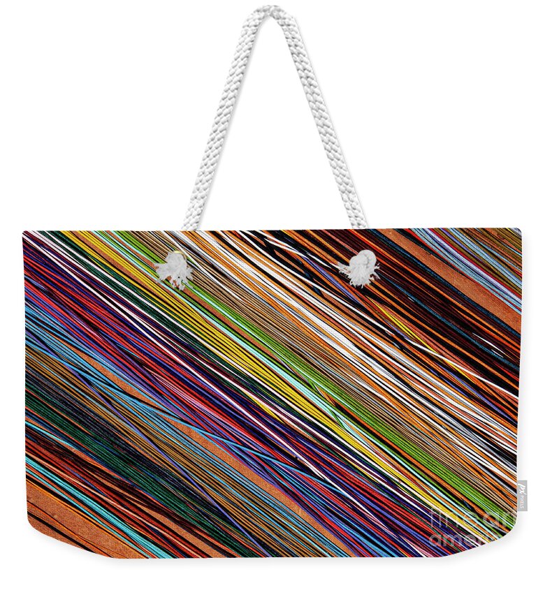 Apt Weekender Tote Bag featuring the photograph Colorful Leather Strips at Apt Market by Bob Phillips