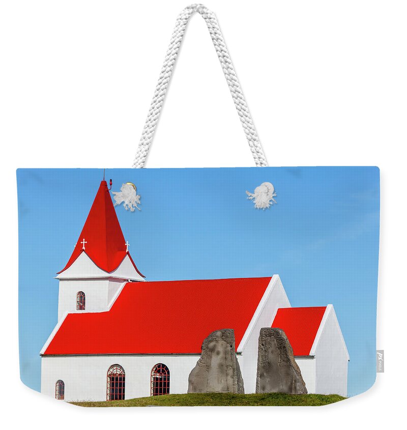 Iceland Weekender Tote Bag featuring the photograph Concrete Church of Iceland by David Letts
