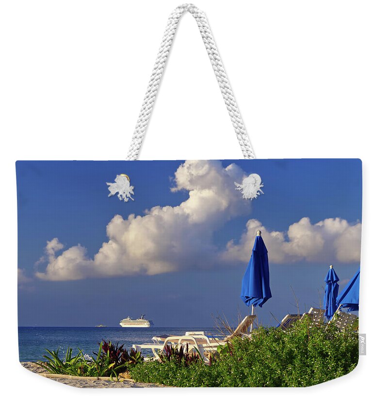 Cozumel Weekender Tote Bag featuring the photograph Cozumel Cruise Blues - Cruise ship off the beach of Cozumel Mexico with Blue beach umbrellas by Peter Herman
