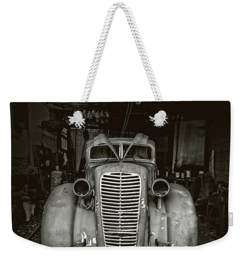 Black Weekender Tote Bag featuring the photograph Ghost Town Vintage Car by Edward Fielding