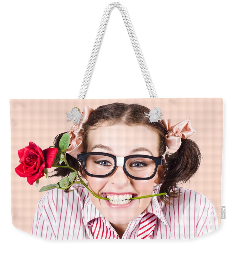 Funny Weekender Tote Bag featuring the photograph Cute Smiling Woman Wearing Nerd Glasses With Rose by Jorgo Photography