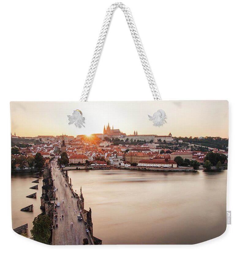 Castle Weekender Tote Bag featuring the photograph Czech capital city with Charles bridge at sunset by Vaclav Sonnek