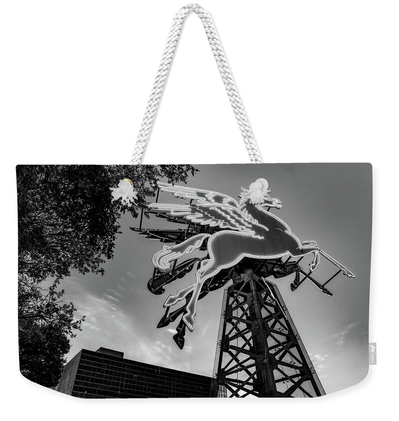 America Weekender Tote Bag featuring the photograph Dallas Pegasus In Front Of Omni Hotel - Black and White by Gregory Ballos