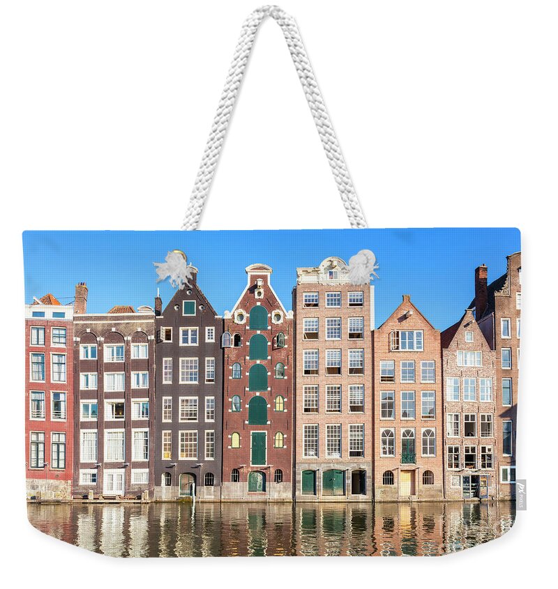Amsterdam Weekender Tote Bag featuring the photograph Damrak houses, Amsterdam by Neale And Judith Clark