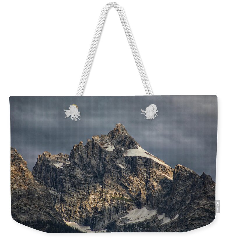 Mountain Weekender Tote Bag featuring the photograph Dark and Moody Tetons by Go and Flow Photos