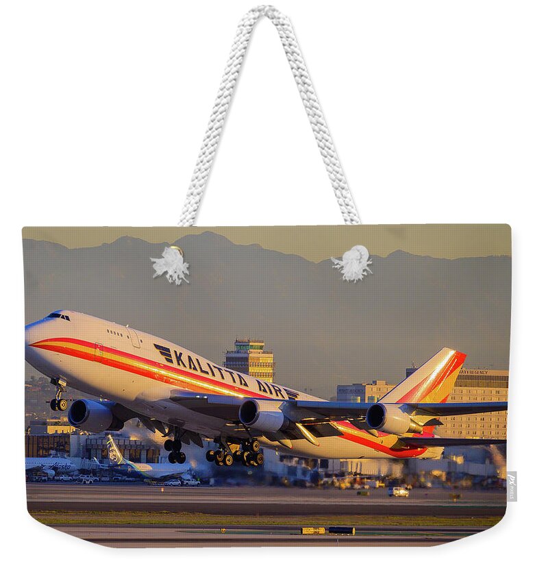 Jet Weekender Tote Bag featuring the photograph Dawn 747 Take Off by Douglas Castleman