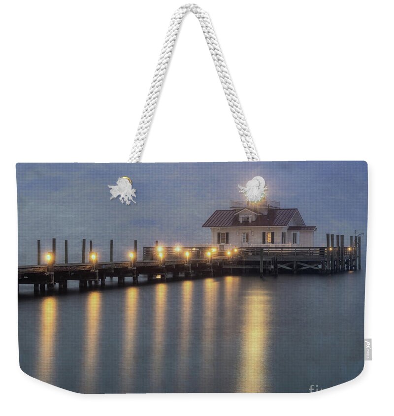 Manteo Weekender Tote Bag featuring the photograph Dawn at a lighthouse by Izet Kapetanovic
