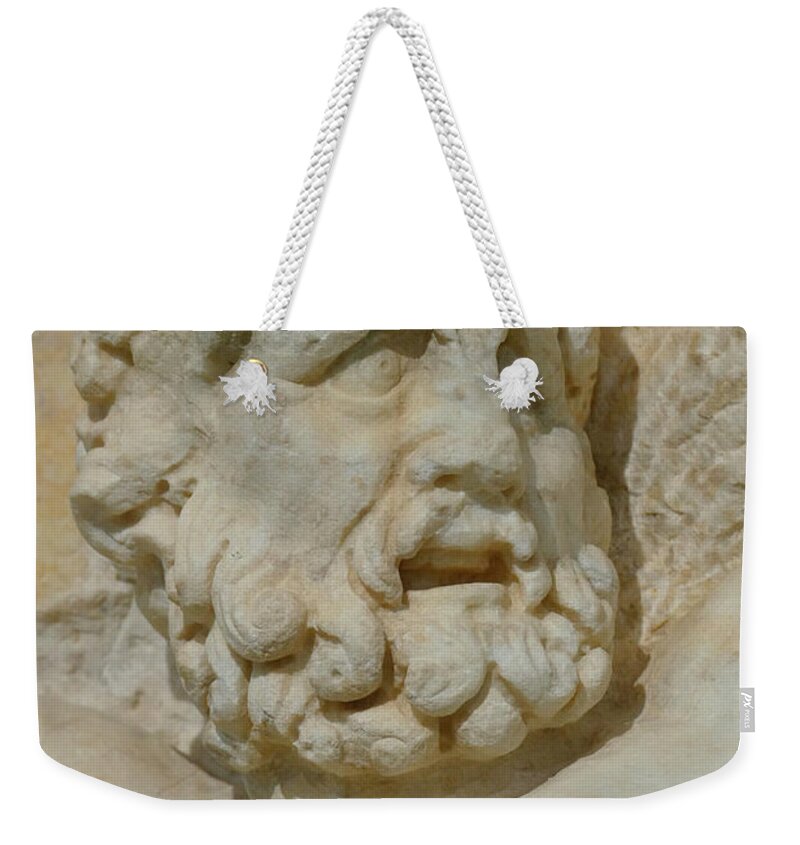Antique Weekender Tote Bag featuring the photograph Detail of head of Prometheus by Steve Estvanik