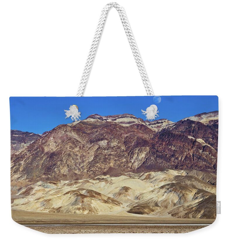 Tom Daniel Weekender Tote Bag featuring the photograph Devil's Golf Course Mts and Moon by Tom Daniel