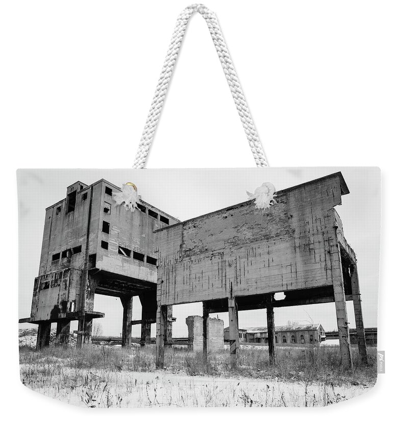 Dark Weekender Tote Bag featuring the photograph Dilapidated industrial building by Martin Vorel Minimalist Photography