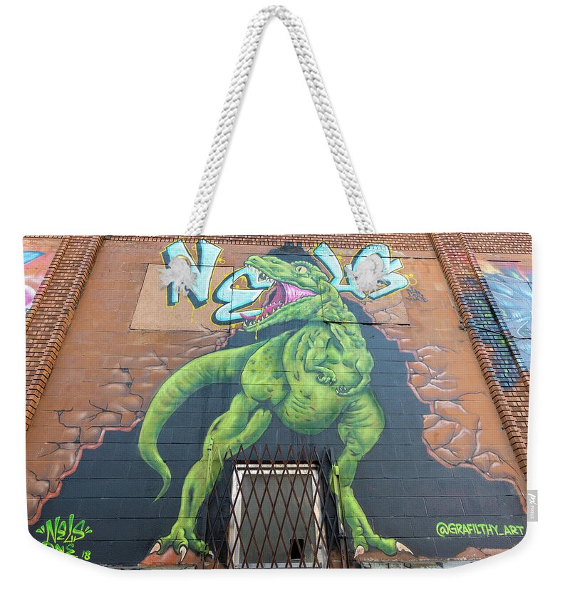 Bluff City Weekender Tote Bag featuring the photograph Dinosaur by Darrell DeRosia