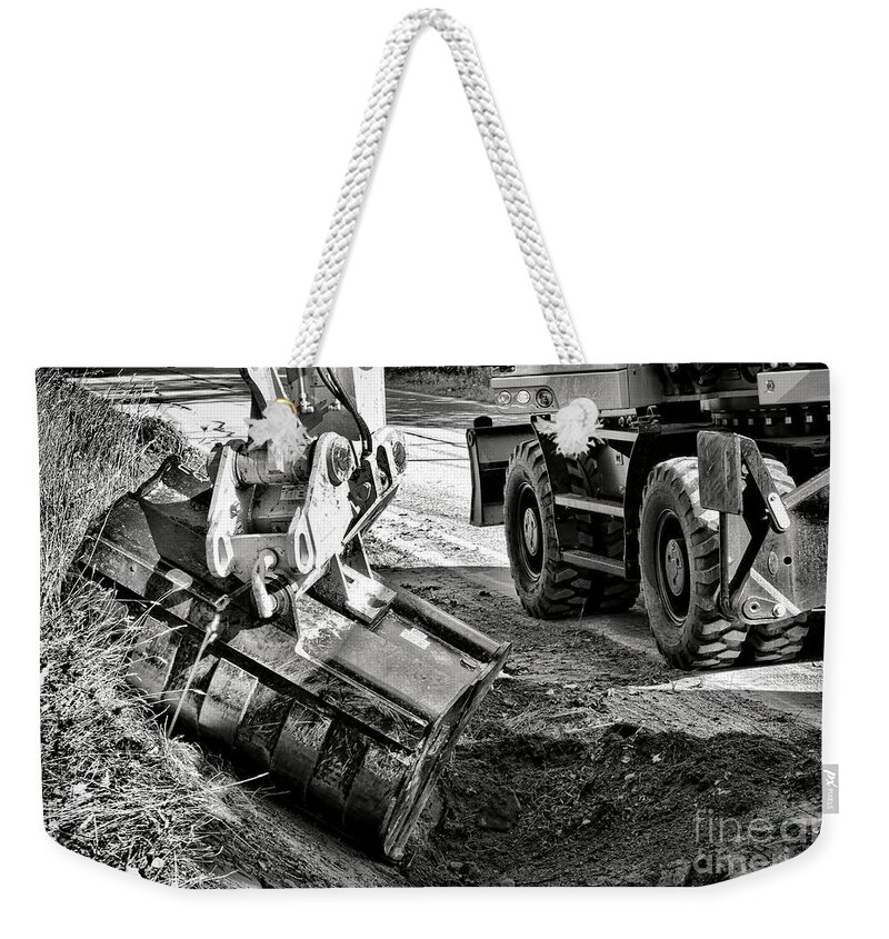 Scoop Weekender Tote Bag featuring the photograph Ditch Digging by Olivier Le Queinec