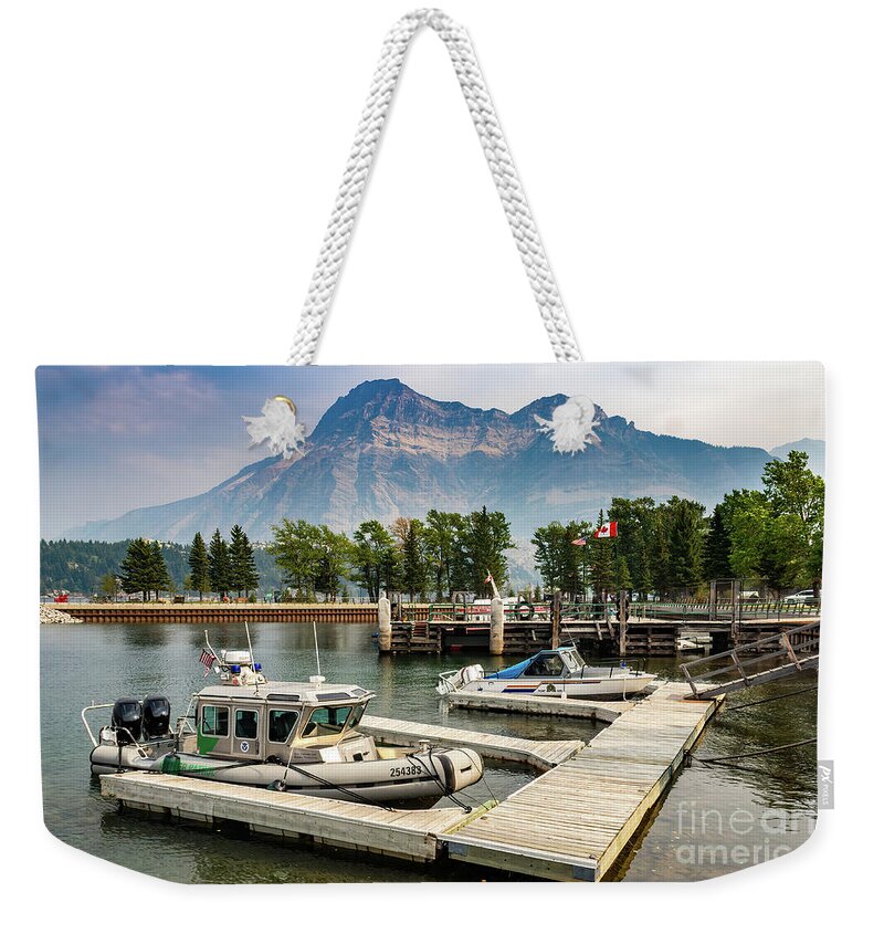 Waterton Lake Weekender Tote Bag featuring the photograph Dock at Warterton Lake with Boats by Roslyn Wilkins