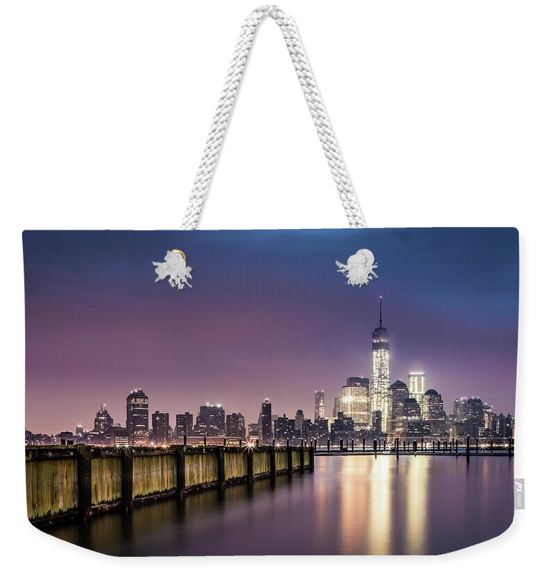 New York Weekender Tote Bag featuring the photograph Downtown New York as observed from Jersey City by Mihai Andritoiu
