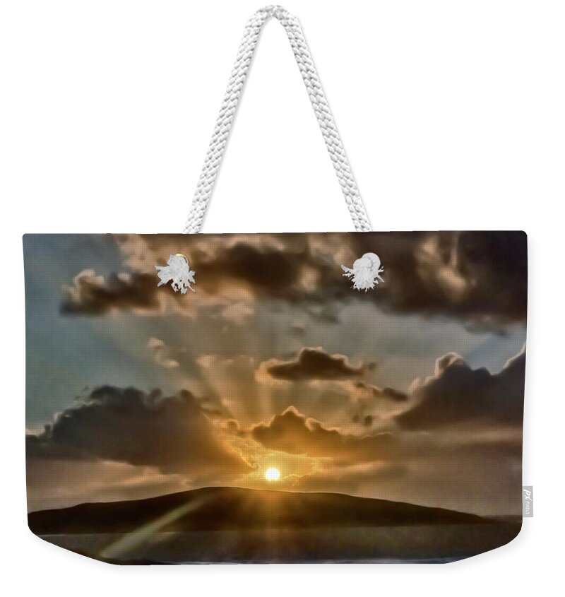 Dramatic Sunset Blue Yellow Round Sun Rays Glen Water Sea Mountain Beautiful Magnificent Stunning Serenity Solitary Nature Powerful Clouds Sky Shining Scotland Harris Highlands Mountains Setting Landscape Panorama Panoramic Breathtaking Spectacular Exciting Mindfulness Relaxing Artistic Unwinding Stylish Exceptional Singular Memorable Phenomenal Eccentric Awesome Electrifying Stimulating Intoxicating Sensational Thrilling Splendid Atmospheric Aesthetic Charming Outer Hebrides Fantastic Magical Weekender Tote Bag featuring the photograph Dramatic sunset at sea and mountains by Tatiana Bogracheva
