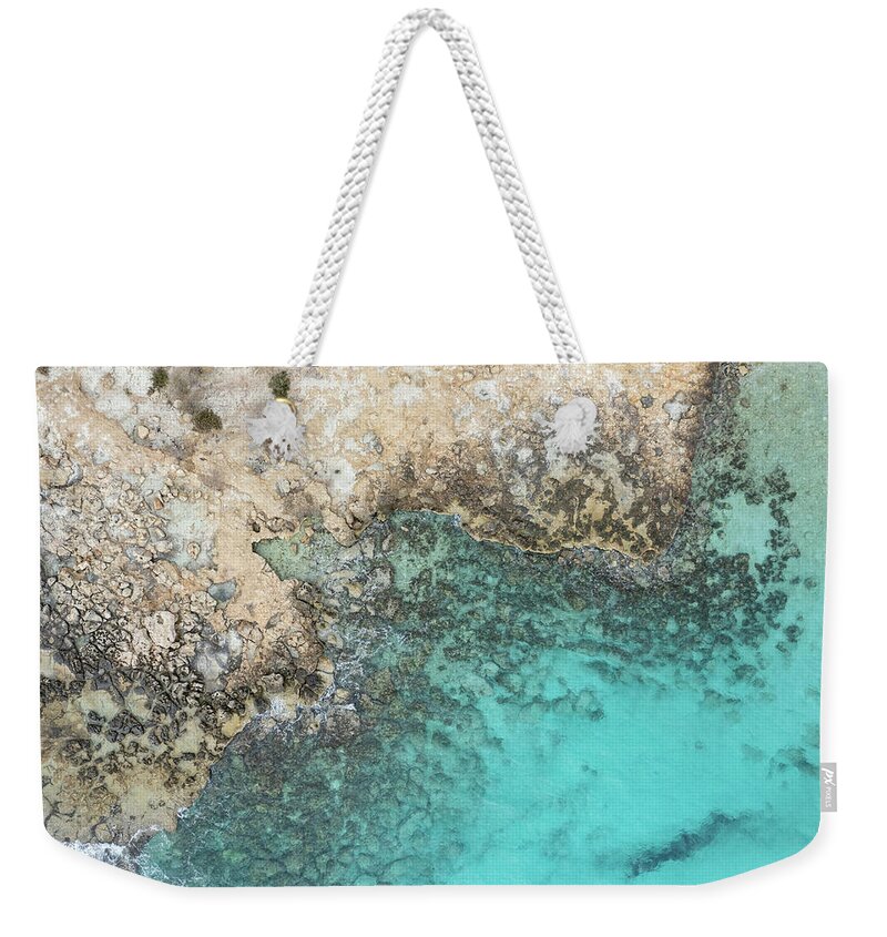 Rocky Beach Weekender Tote Bag featuring the photograph Drone aerial of rocky sea coast with transparent turquoise water. Seascape top view by Michalakis Ppalis