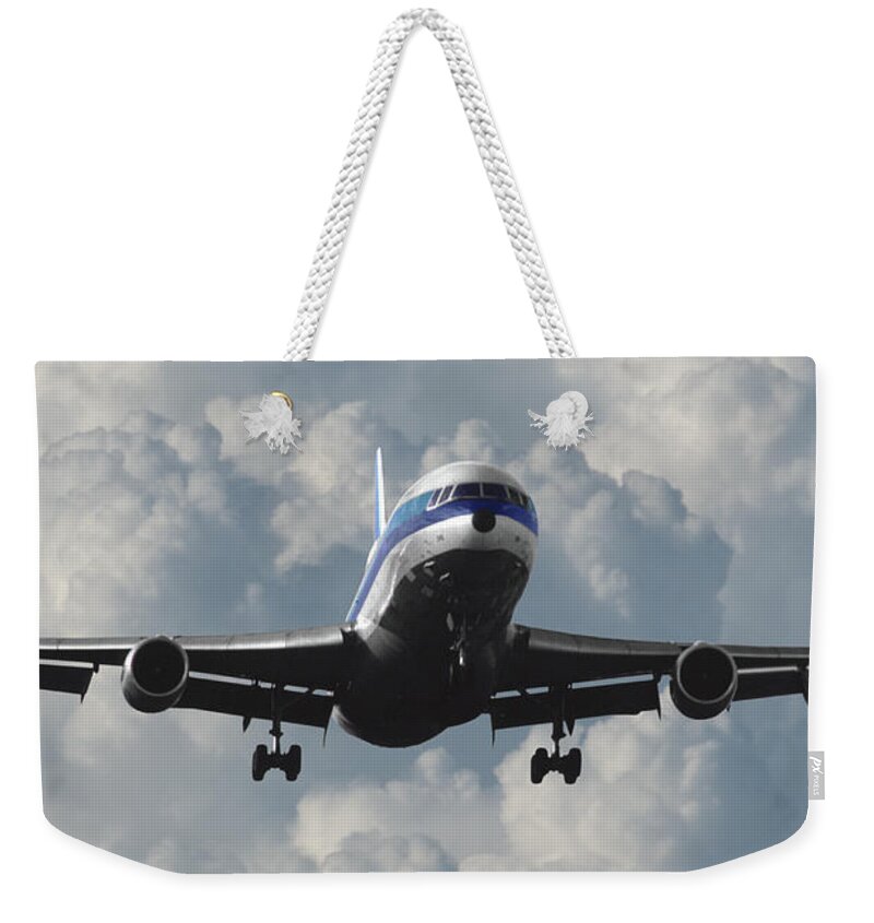Eastern Airlines Weekender Tote Bag featuring the photograph Eastern L-1011 Landing at Miami by Erik Simonsen