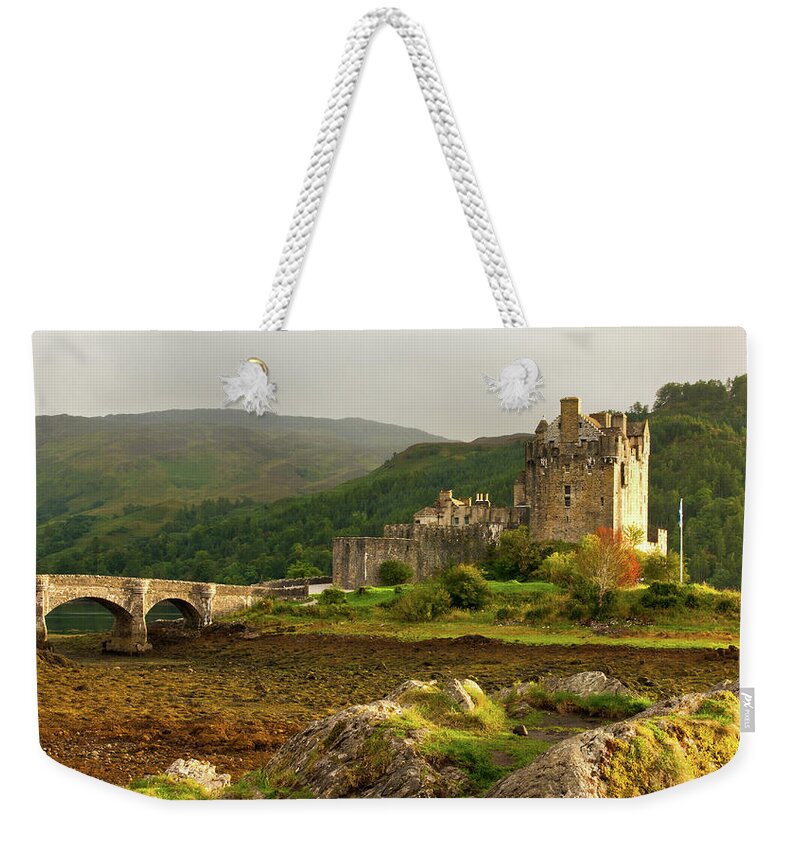 Scotland Weekender Tote Bag featuring the photograph Eilean Donan Castle in the loch Alsh at the highlands of Scotlan by Michalakis Ppalis