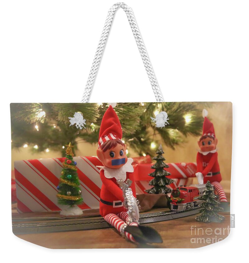 Elf Weekender Tote Bag featuring the photograph Elf in Trouble by Darrell Foster
