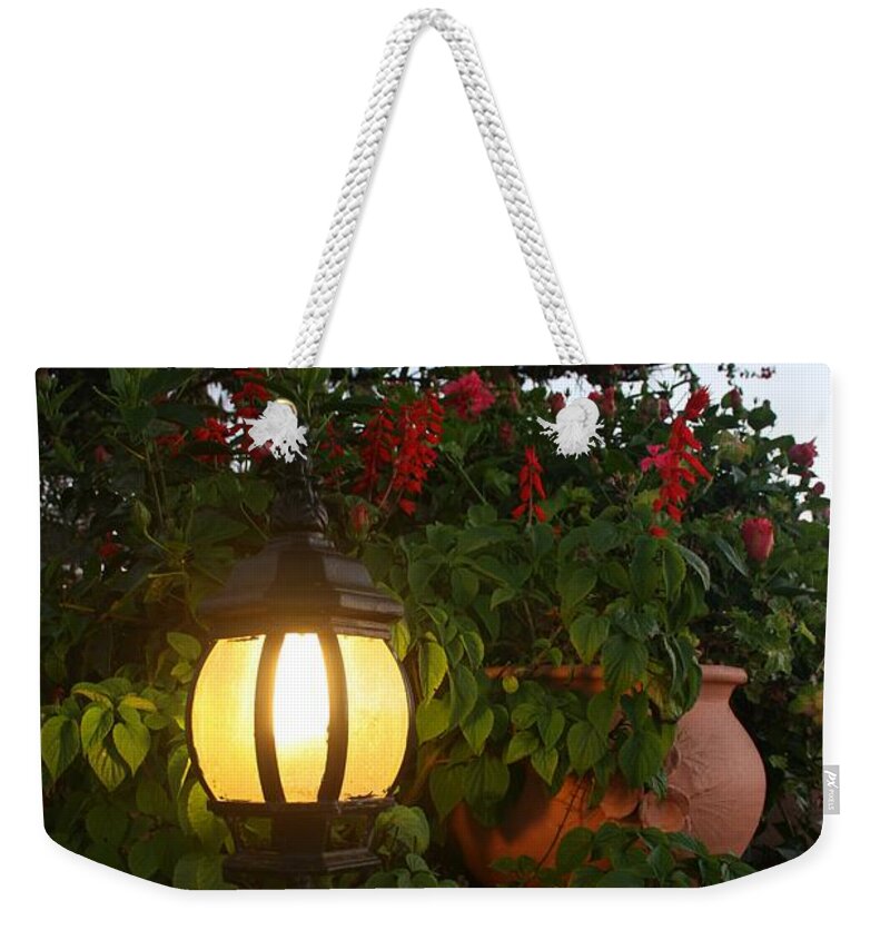 Oualida Weekender Tote Bag featuring the photograph Enjoy your stay by Laurie Lago Rispoli