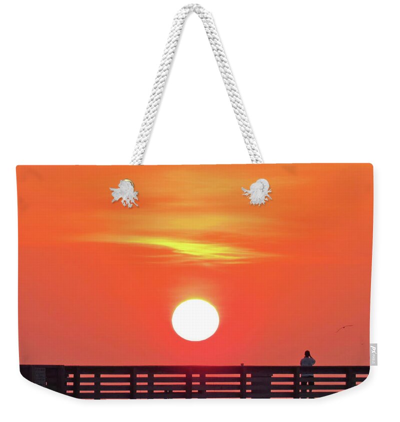 Sunset Weekender Tote Bag featuring the photograph Evening Performance at Sunset in Orange by Roberta Byram