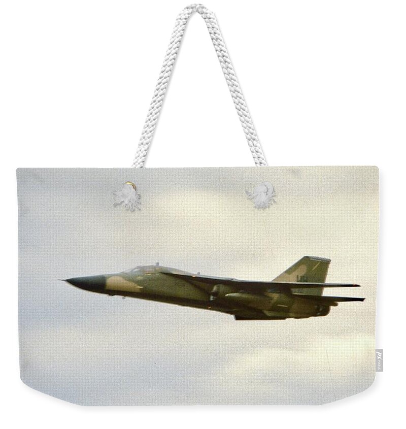General Dynamics Weekender Tote Bag featuring the photograph General Dynamics F-111 by Gordon James