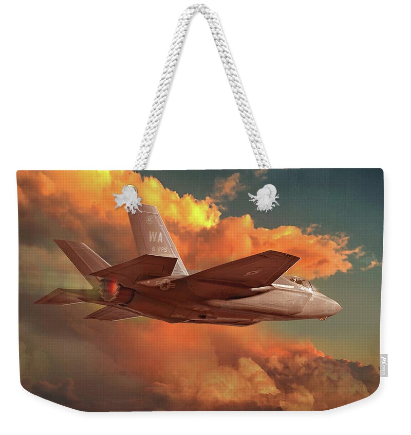 F-35 Weekender Tote Bag featuring the digital art F-35 jet fighter skirting sunset thunderhead by James Vaughan