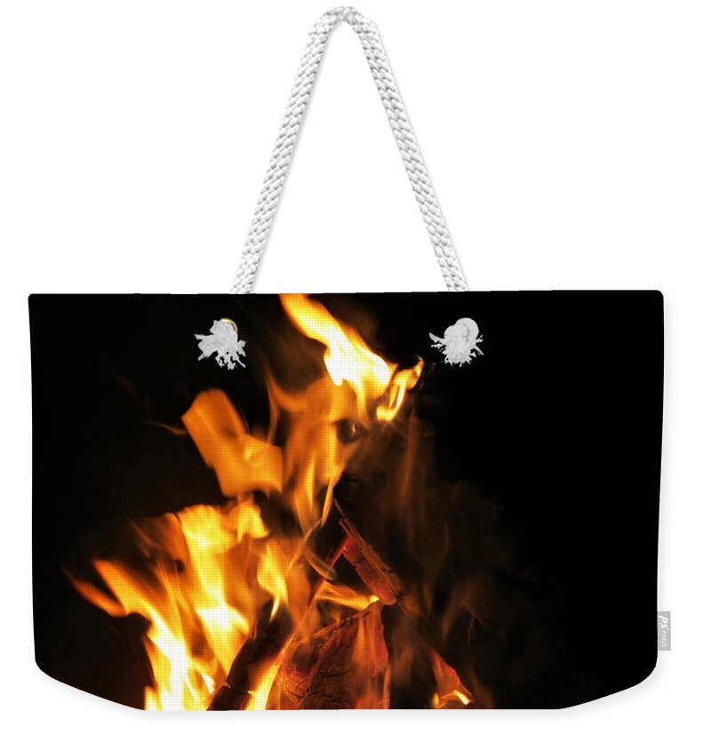 Fire Weekender Tote Bag featuring the photograph Face in the Fire by Azthet Photography