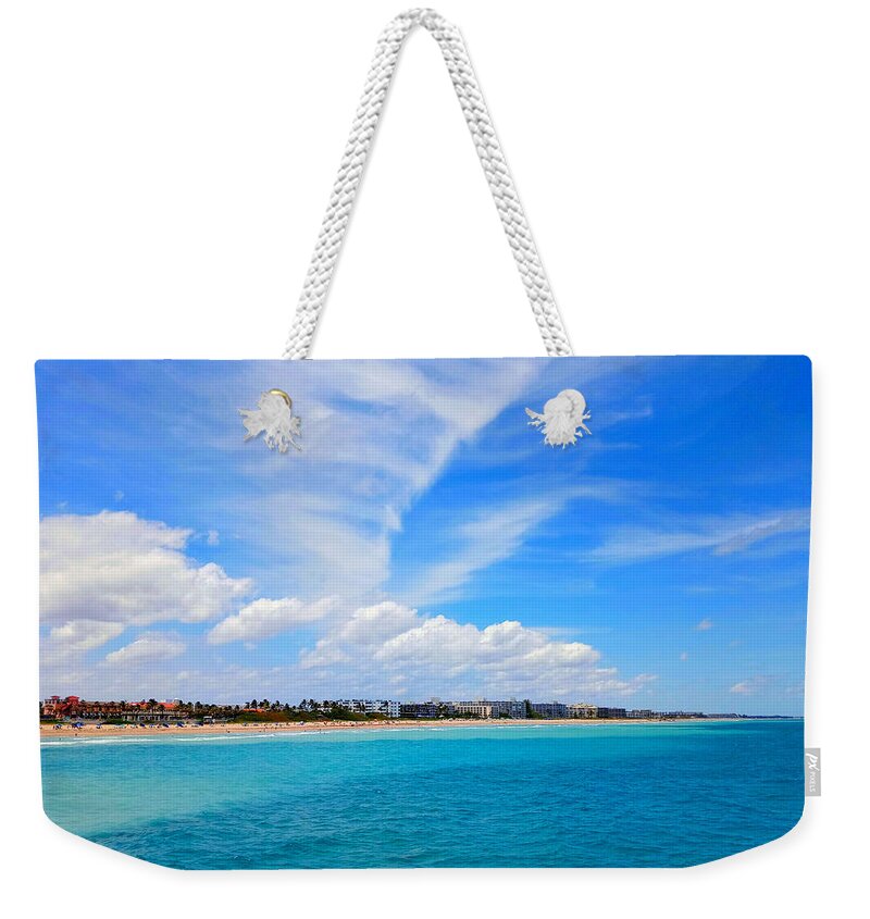 Clouds Weekender Tote Bag featuring the photograph Face in the Sky, Tears From an Eye by Dani McEvoy