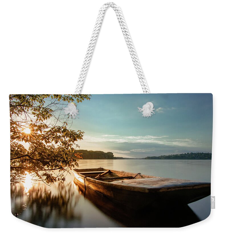 Rowboat Weekender Tote Bag featuring the photograph Fairy-tale boat moored on the shore by Vaclav Sonnek