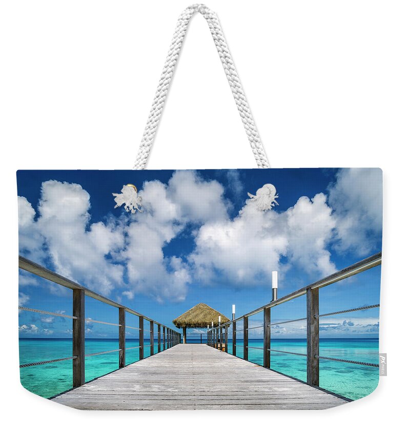 Rangiroa Weekender Tote Bag featuring the photograph Rangiroa - perspective by Olivier Parent