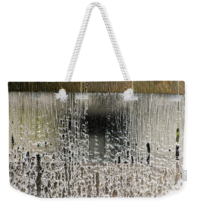 Fountain Weekender Tote Bag featuring the photograph Fallen by Kerry Obrist